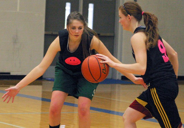 Falcon sophomore Abby Hodson pressures sophomore Anne Madsen during a recent practice. Ball handling will be critical to the Falcons’ success or failure this season.
