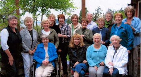 The Nightcrawlers gather for a group photo in June at the Farmhouse Bed & Breakfast in Clinton during its June salad potluck. The Nightcrawlers pictured are