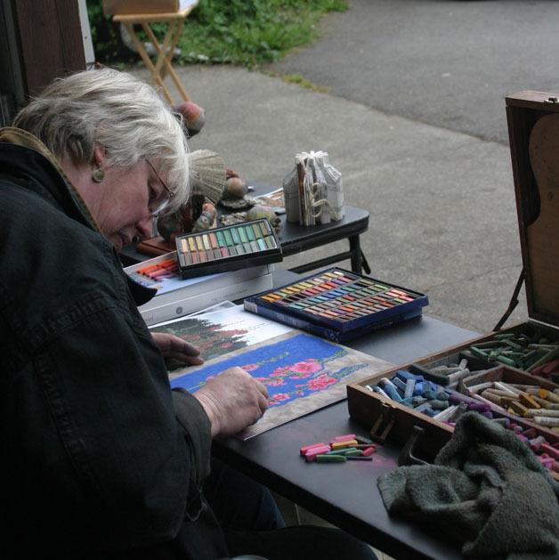 Susan Jensen demonstrates pastel drawing at the Saturday Art Show at Bailey’s Corner.