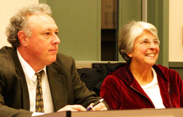 School board members Damian Greene and Linda Racicot enjoy the kudos sent their way last week by School District Superintendant Jo Moccia.