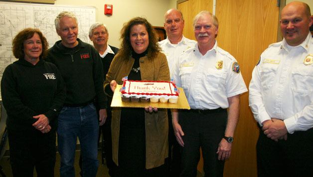 Representing the fire district and on hand to enjoy the baked sweets are Candace Shields