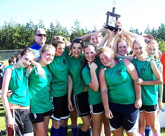 Fourth time’s a charm. The South Whidbey U-15 girls soccer team holds the spring tournament trophy for the fourth year in a row.