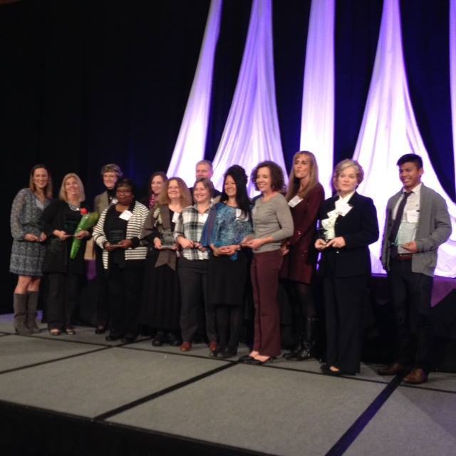 Nurses who received 2015 March of Dimes awards stand on stage together during the presentation ceremony.