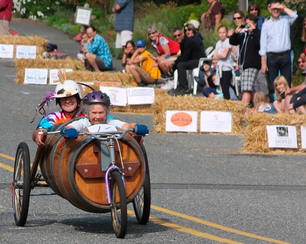 South Whidbey Record reporter Ben Watanabe  won second place in general news photos at the Washington Newspaper Publishers Association's annual contest for his shot of Greg and Elizabeth Osenbach at the 2014 Soup Box Derby.