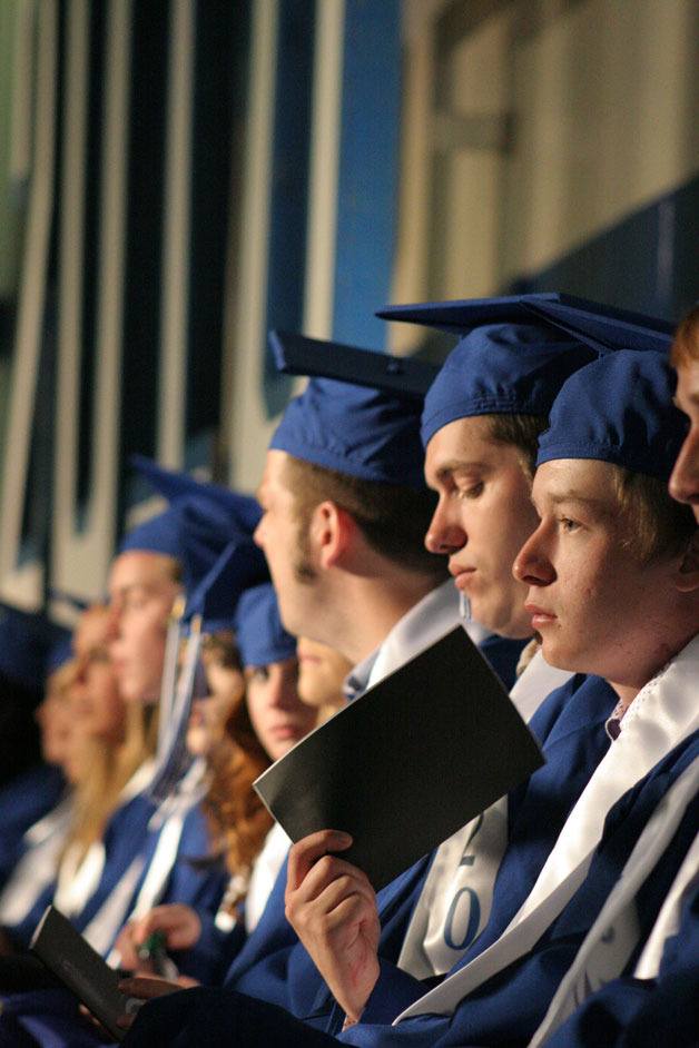 The Class of 2010 awaits the presentation of diplomas during commencement earlier this year. The South Whidbey School Board is considering adding two new dates for graduation for seniors who have met their requirements — one in February for students who can finish the year early