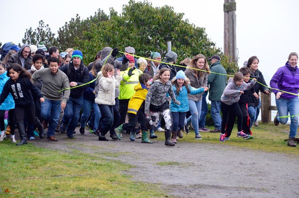 Children and adults burst from the starting line at the Sea Float Scramble in Langley in 2015. Langley is in the running for the happiest seaside town in America