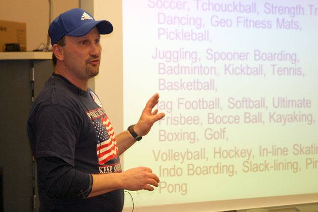 Langley Middle School physical education teacher Erik Jokinen presents a slideshow demonstrating the importance of physical education to South Whidbey students. He’s worried that cuts would harm the program and