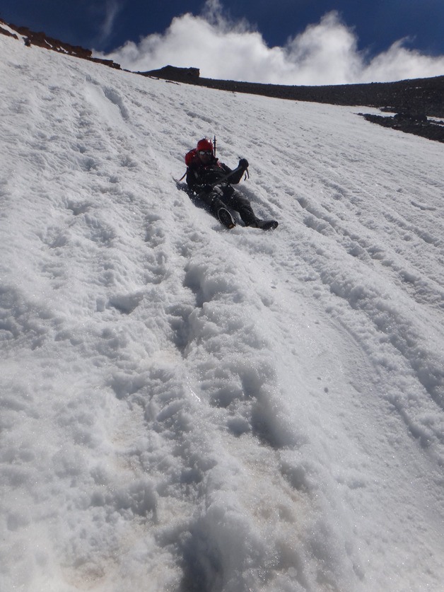 Freeland resident Chris Kesler slides down the snowpack of Mount Shasta