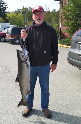 Paul Stokke of Langley weighs a king salmon he caught April 14 off Camano Island. It weighed in at 21 pounds.