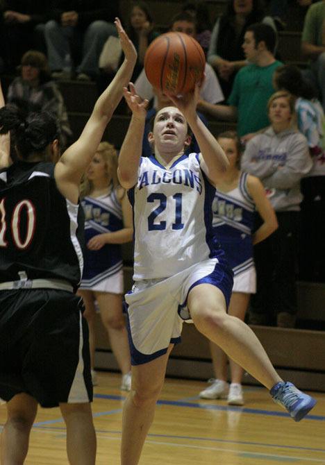 South Whidbey's Ashlinn Prosch drives to the hoop for two against Archbishop Murphy.