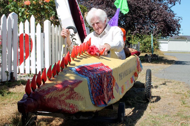 Clinton resident Peter Lawlor shows off his refurbished Soup Box Derby kart