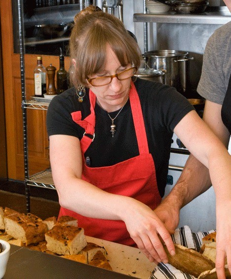 Ca’ buni chef Jess Dowdell works on the presentation of some baked items recently at her café kitchen at Mukilteo Coffee Roasters in the woods of Langley.