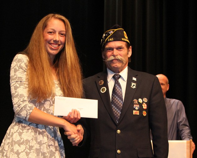 Isla Dubendorf receives a scholarship from American Legion Post 141 during the annual scholarship night Tuesday