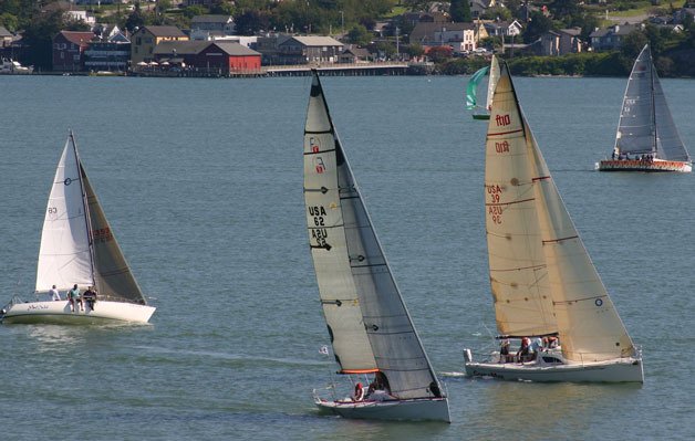 Brightly colored sailboats will race through Penn Cove all week for Race Week.