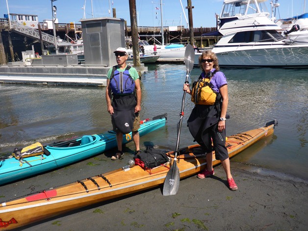 John and Sue Ellen White pose for a picture at Langley Marina. The South Whidbey couple kayaked around the island in three legs