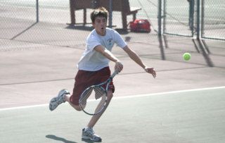 Falcon Van Morgen returns a serve from Bellingham’s Andrew Troutman on Monday. Morgen and teammate Riley Newman won their matches and are looking forward to the rest of the season.