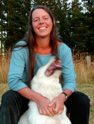 Novelist Karen Fisher plays with her dog