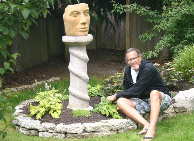Tim Callison of Langley tends to his garden ahead of the South Whidbey Garden Tour which begins Saturday