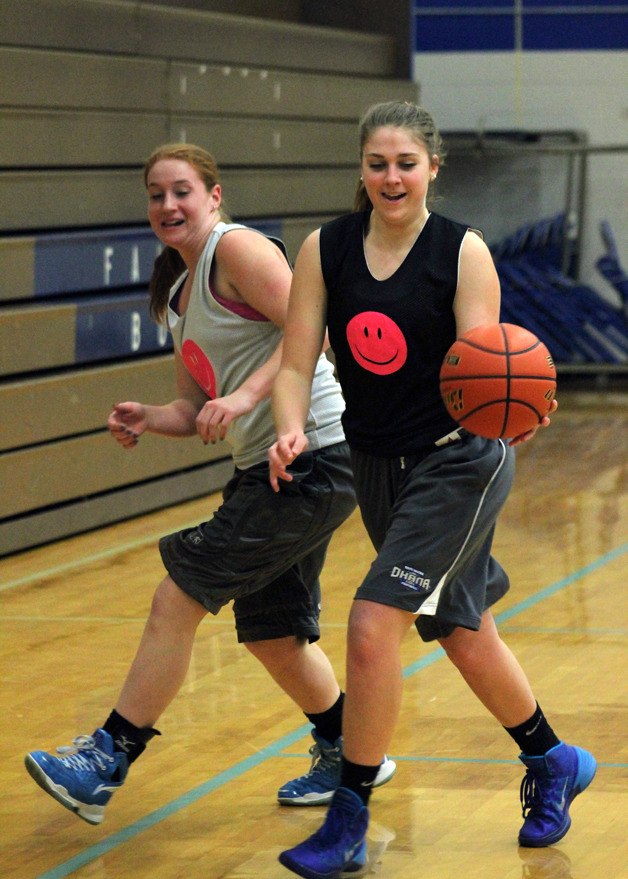 Senior forward Abby Hodson dribbles away after a rebound from junior Emily Turpin.