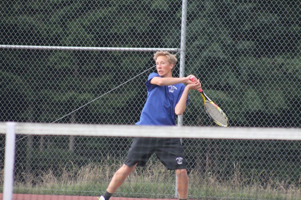 Falcon senior Jacob Nelson volleys a shot during his doubles match against Coupeville’s John McClarin and Joseph Wedekind at South Whidbey’s home match on Thursday. Nelson and his partner sophomore Hank Papritz beat the Wolves 6-3