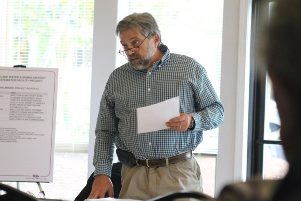 Freeland Water and Sewer District Commissioner John Brunke speaks during a meeting Tuesday aimed at gathering public feedback on the district's plan to build sewers in the commercial core.