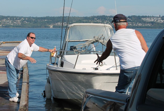 Tom Jones of Arlington throws a line to Bob Briggs