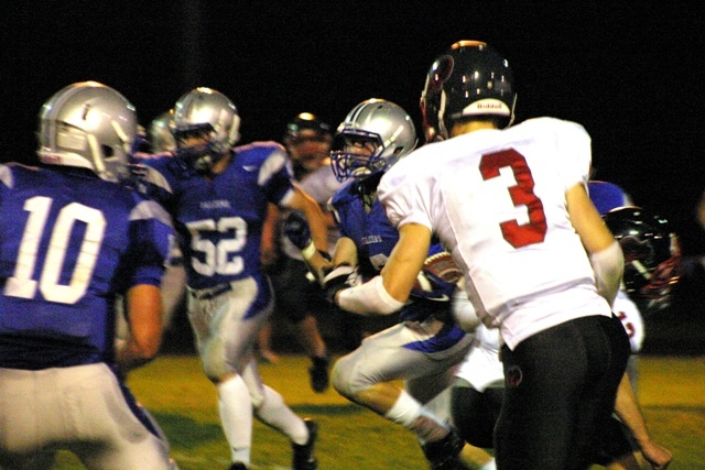 Sam Lee looks for blockers Avery Buechner (10) and Mason Shoudy (52) during a 50-yard catch and run during the first quarter against King's on Friday.
