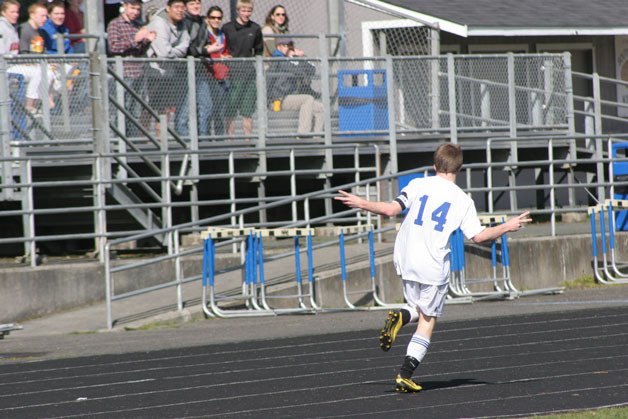 South Whidbey's Pat Myatt takes a quick victory lap past the stands after scoring his second goal against Mount Baker.