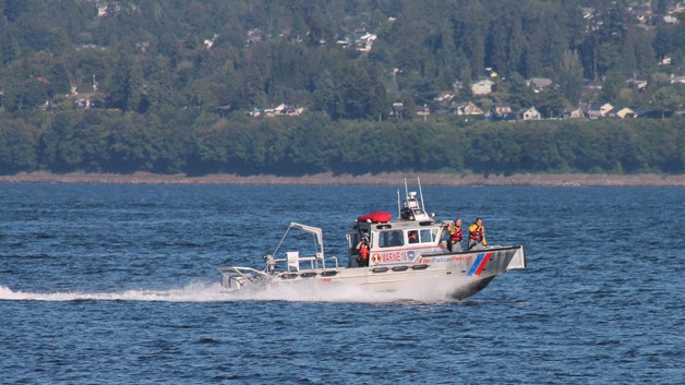 Emergency responders from Camano Fire & Rescue cruise past the Clinton Ferry Terminal on June 4 to search for a pair of reportedly adrift divers. Boats looked between the Columbia Beach area of Clinton and Mukilteo for an hour and found no sign of people in distress.