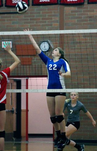 Falcon junior hitter Abby Hodson reaches for a tip kill against Coupeville.