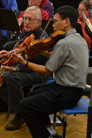 Musicians perform during a Saratoga Orchestra practice in November 2013.