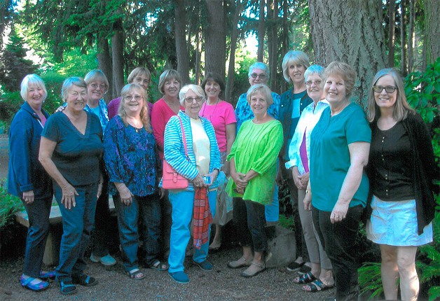 Members of the Nightcrawlers Garden Club pose for a photo. Back row: Barb Bishop