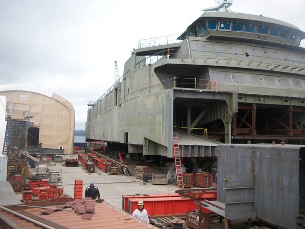 The new Washington State Ferry Tokitae sits at Nichols Brothers Boat Builders in Freeland. The superstructure  will be placed on a barge and towed to Vigor shipyard in Seattle. Windy weather delayed the move until early next week.