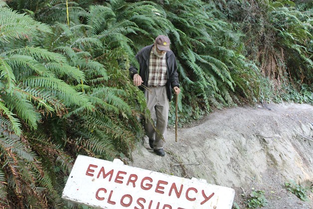 Greenbank resident Michael Seraphinoff maneuvers around the beach access trail at South Whidbey State Park. Wet conditions caused a landslide during the winter of 2015.