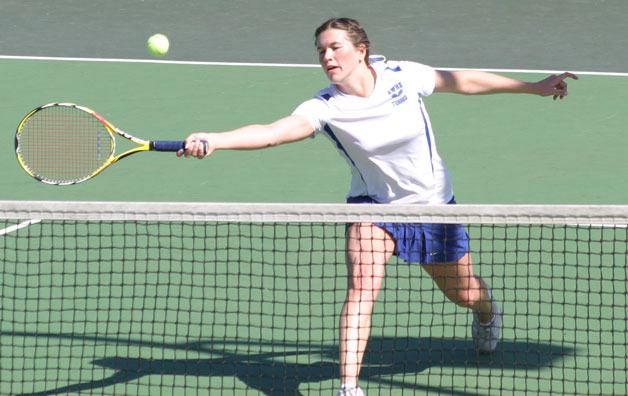 Falcon senior Jessica Cary drops a volley shot across the net against the Anacortes duo of Carly Anderson and Kylee Berlin in the first round match. Cary and her partner Tess Radisch