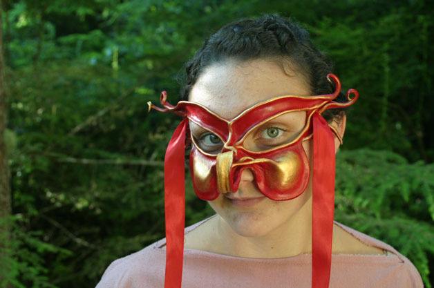 Valerie Huntington wears the mask she made at Nymbol’s Secret Garden in Langley for her part in “Romeo and Juliet.”
