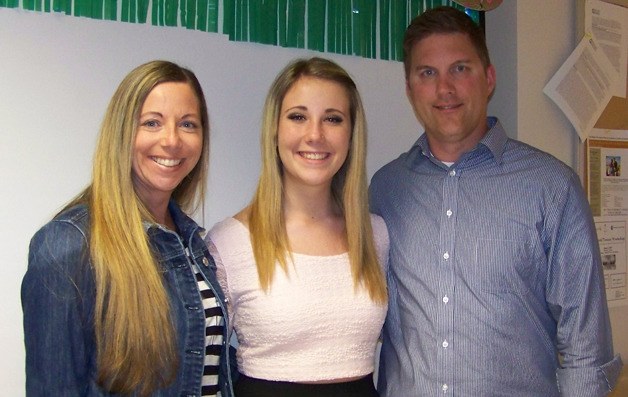 Heather and Chad Saxton celebrate with their daughter