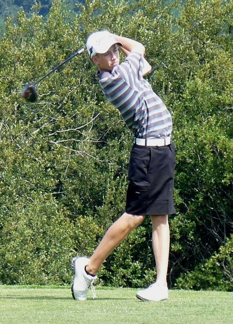 Shane Thompson powers through his swing while on his way to a first-place finish with a 73 at the Washington Junior Golf Association District 1 tournament.