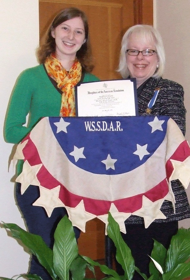 Whidbey Island Chapter of the Daughters of the American Revolution regent  Sally Buckingham (right) presents South Whidbey High School senior Angelica Janda with the  2011 Daughters of the American Revolution Good Citizen Award at St. Peter’s Lutheran Church in Clinton.