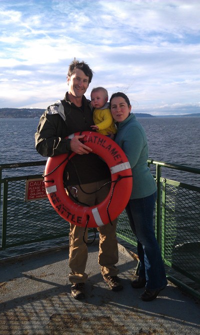 Ryan and Marthë Elting stand with their daughter Alma en route to the Whidbey Island.