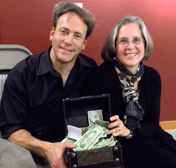 Craig Weiner and author Christina Baldwin display some of the money raised for Healing Circles Langley.