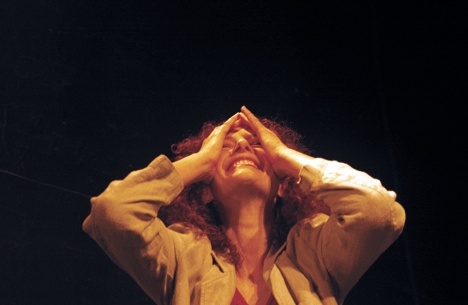 Stacie Chaiken onstage during a performance of one of her solo plays.