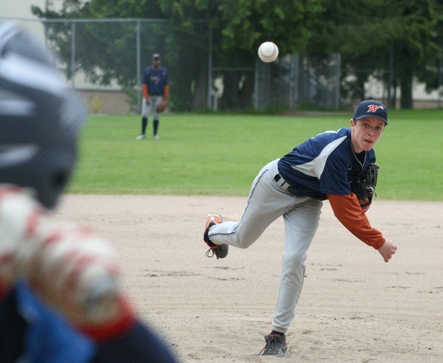 Crabs pitcher Houston Schmutz throws a strike during action against Bothell. Schmutz had two hits in a recent victory against the Terrace Warriors.