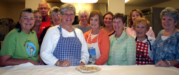 Ben Watanabe / The Record These folks take a break after a power session of cooking lefse for the Trinity Lutheran Church bazaar. The sweet bread will be sold in packs of four at the sale from 9 a.m. to 3 p.m. Saturday