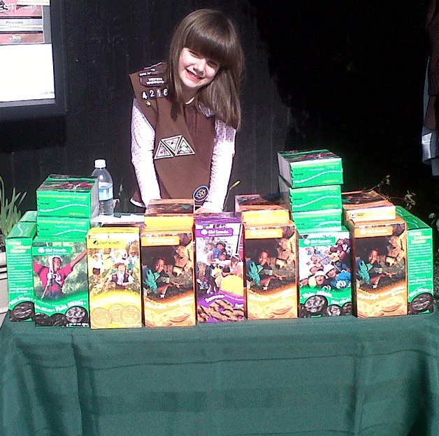 Kristen Riley sells Girl Scout cookies at the Star Store in Langley.
