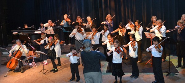 Island Strings students perform alongside instructors during the 40th anniversary concert.