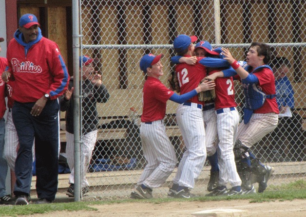 Phillies coach Henry Pope watches Trenton Piehler