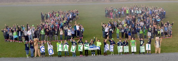 Students at Langley Middle School formed a 12 on the field Friday afternoon at a Seahawks-themed school assembly.