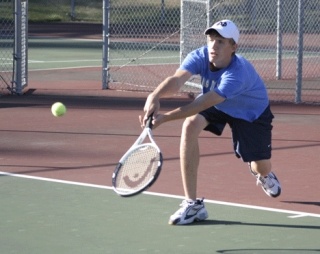 Falcon Jon Adams works on perfecting his volley skills Thursday as his team gets ready for the Mount Vernon Bulldogs.