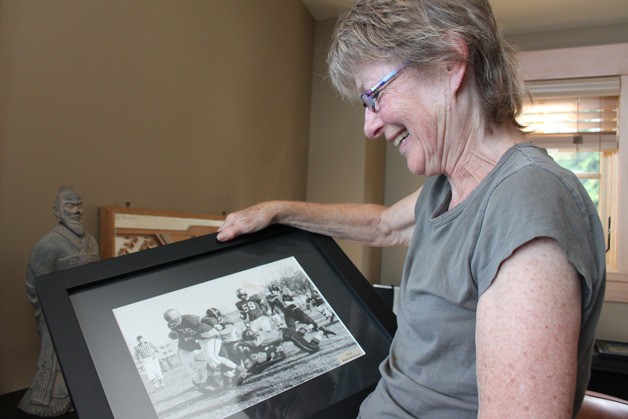 Pam Schell holds a framed picture of her recently deceased husband